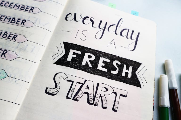 Inspirational Quotes for Work and Team Bayanihan: Filipino Values That Move Us Forward 1 Notebook page featuring motivational quote 'Everyday is a fresh start' with colorful pens.